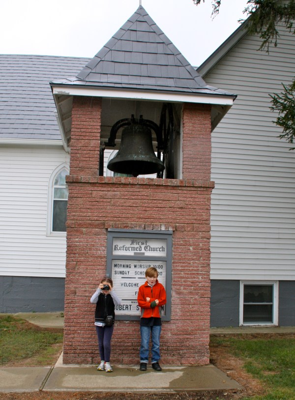 In front of the bell tower.  Sonora - our budding journalist has here camera ready.